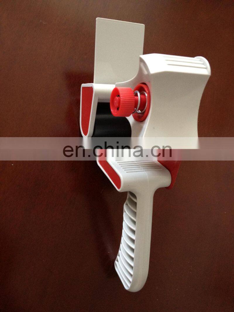 Handheld gun tape dispenser