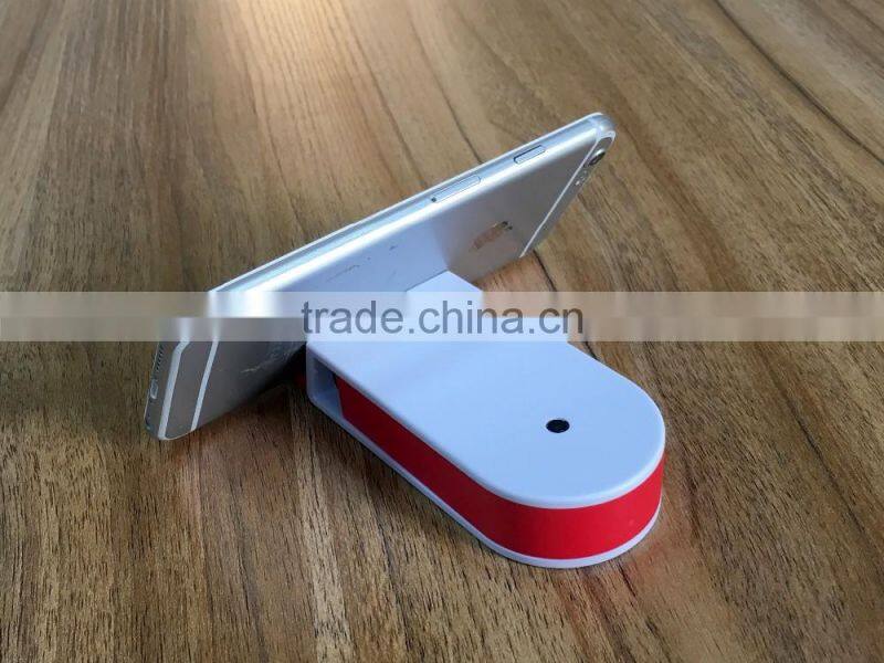 Multifunctional sticker with pen/mobile phone holder