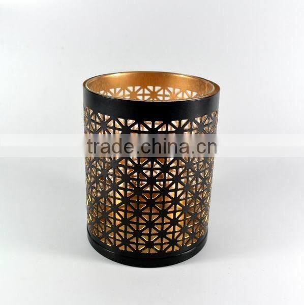 Golden cylinder candle holder