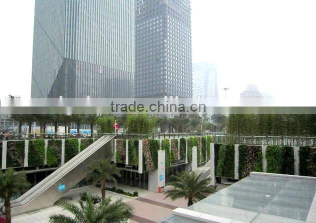 artificial plant wall with leaves/flowers/grass