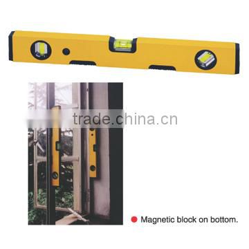 Spirit level with magnet on bottom