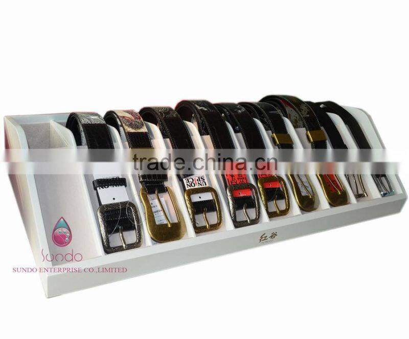 custom white lacquered wood belt display