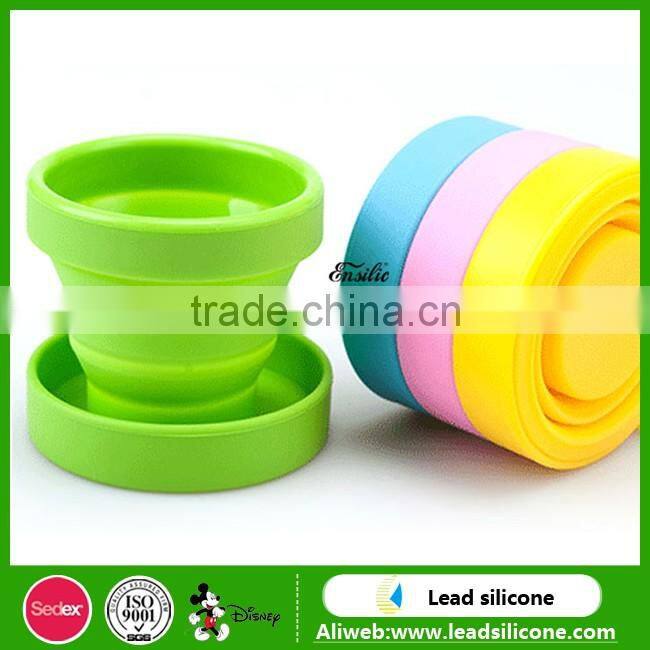 Heat resistant collapsible double wall glass cup with silicone lid