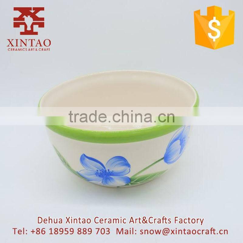 Small white ceramic soup bowl with green rim for hotel use