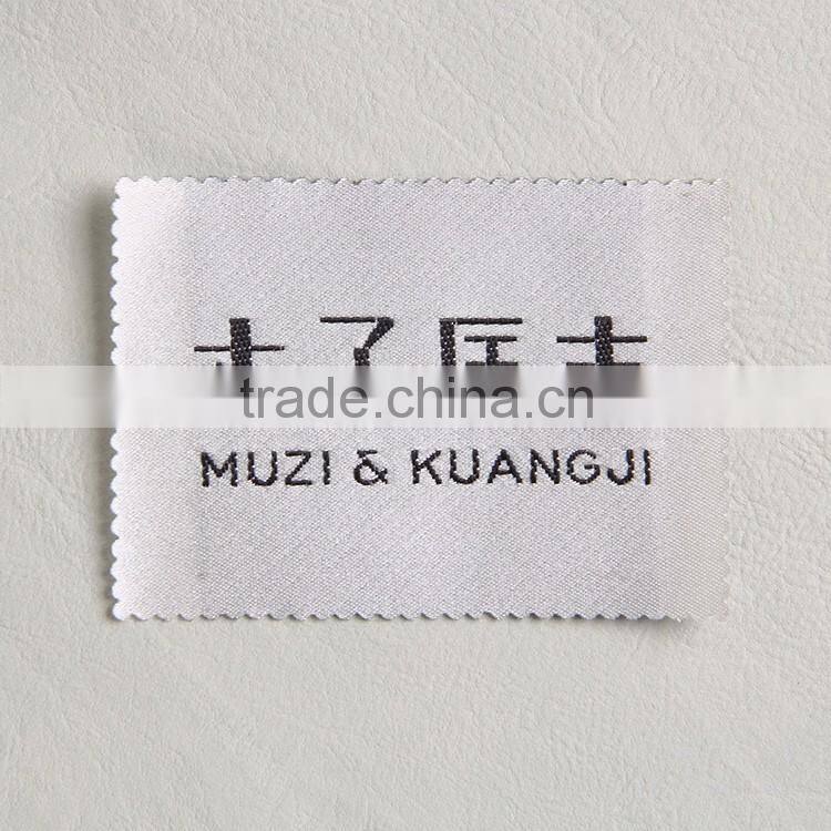 common woven label with laser processing for a woman coat