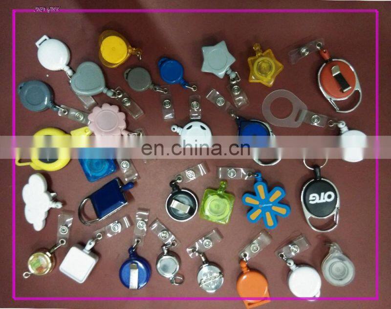 Ski pass badge holder with bottle cap holder