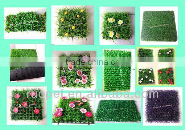 Vertical artificial plastic green wall and hanging decorations