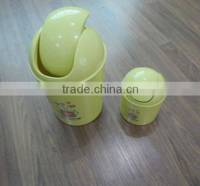 Round swing-top plastic trash can