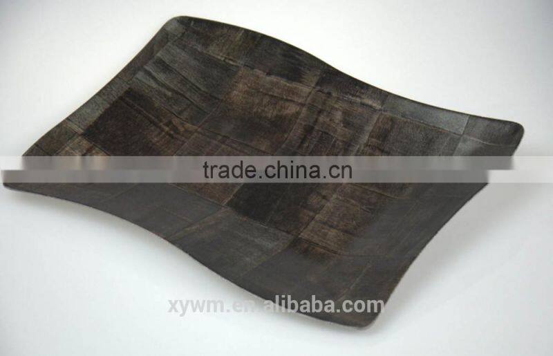 Black woven wooden serving tray and plate