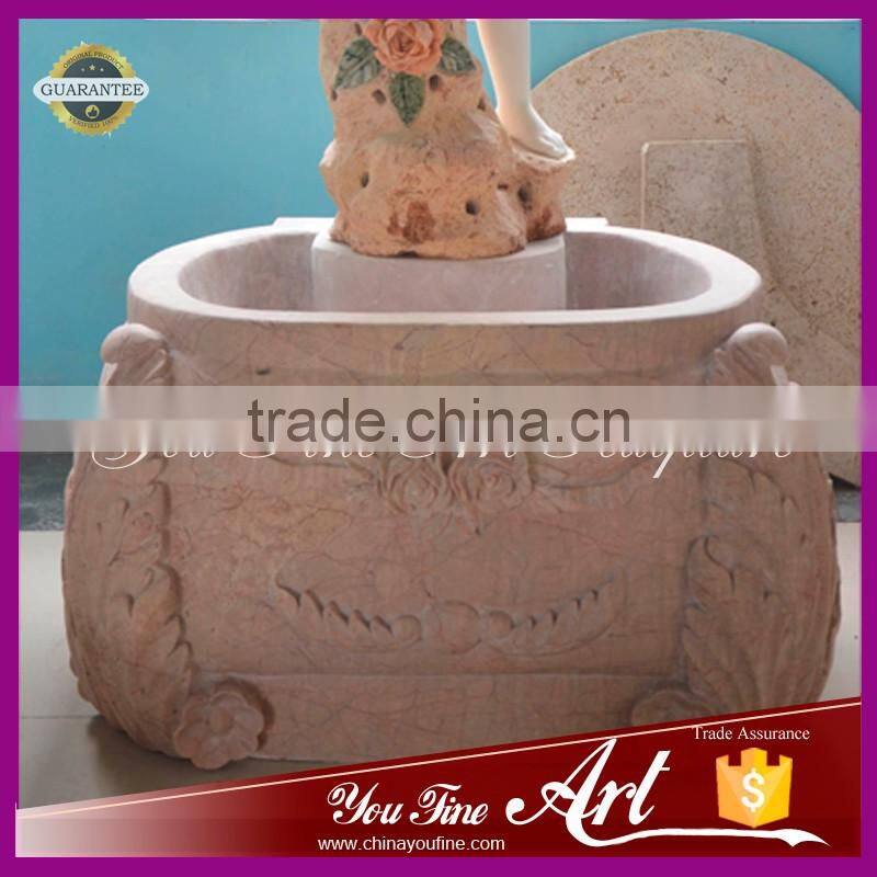 hand carved nature stone fountain with little boy