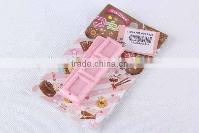 Chocolate shaped hair brush with hanging chain/folding comb