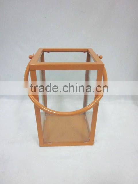 square metal lantern with clear glass piece