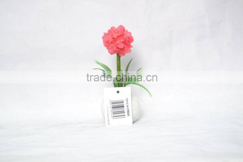 Artificial flower planted in ceramic pot for home decoration