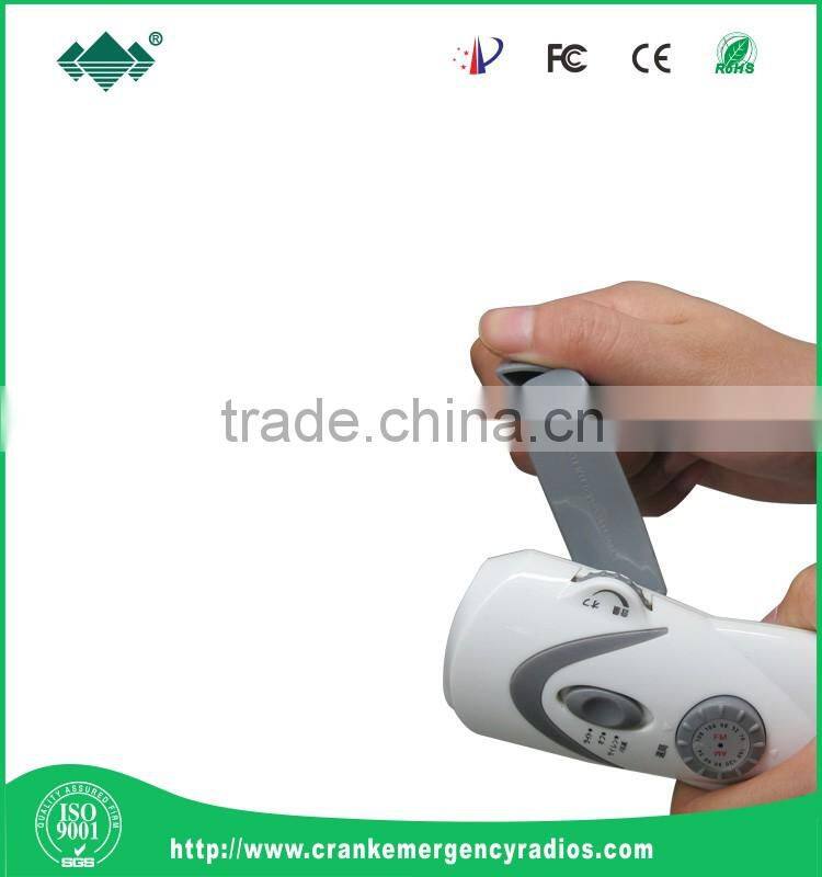 Dynamo hand crank flashlight radio with mobile phone chargers