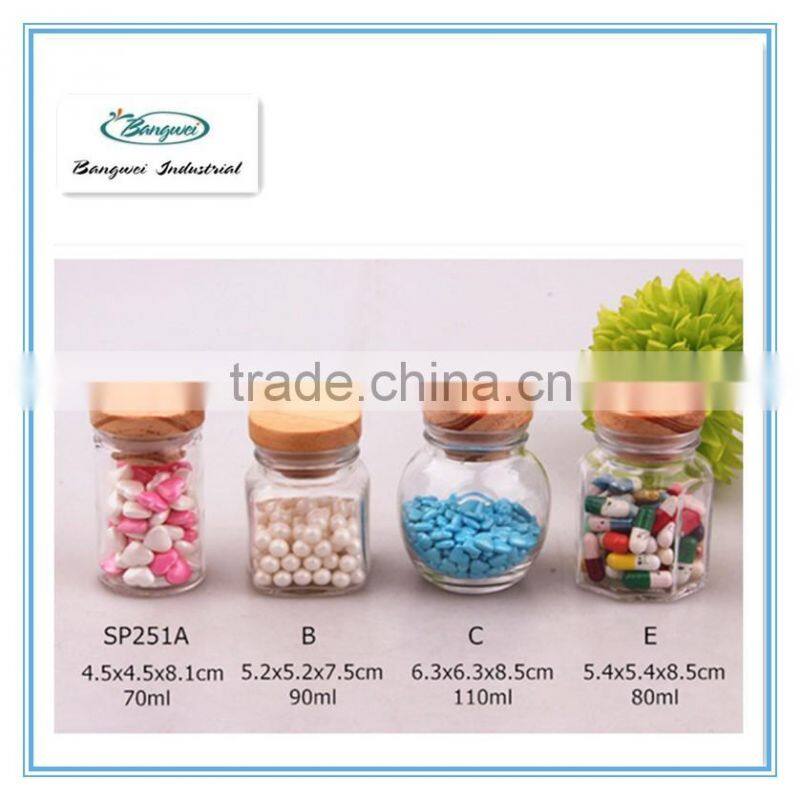small glass spice jar with wooden lid