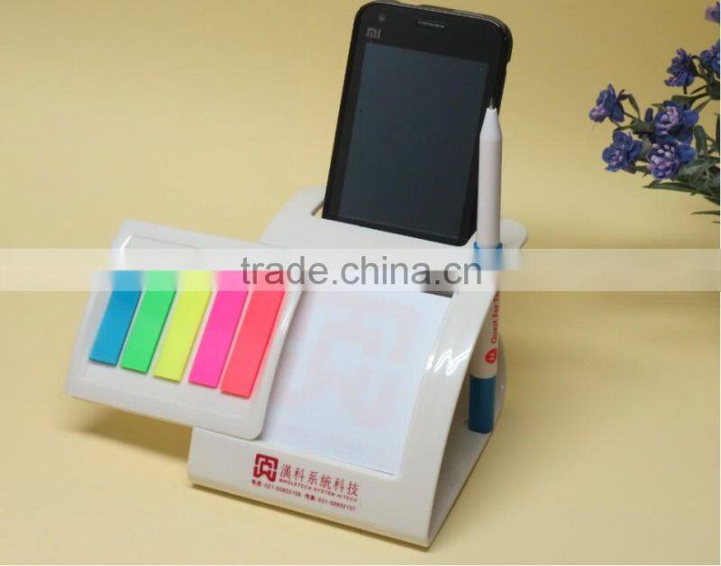 Multifunctional sticker with pen/mobile phone holder