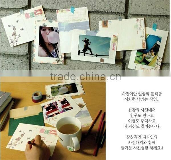 eco-friendly paper picture photo frames hanging over at the rope with wood clamp