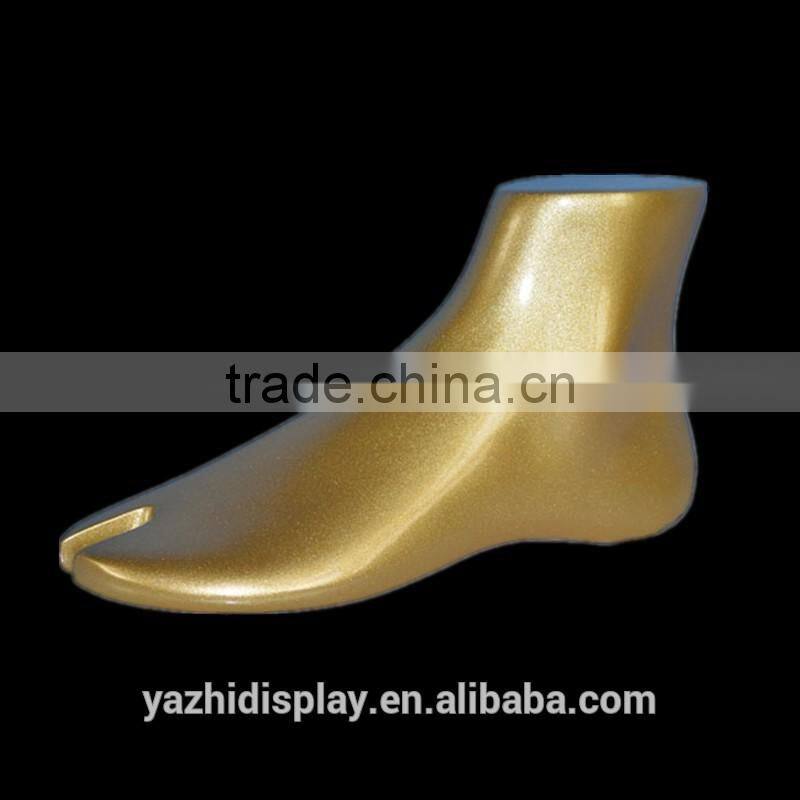 Fashion shoes display Golden mannequin feet and foot