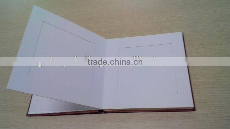 Photo album with brown hard cover and duplex board