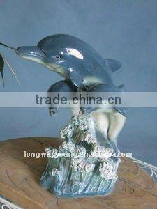 Animal decorations three blue dolphins jump over sea