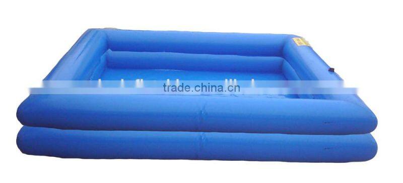 inflatable swimming pool floating on water deployed