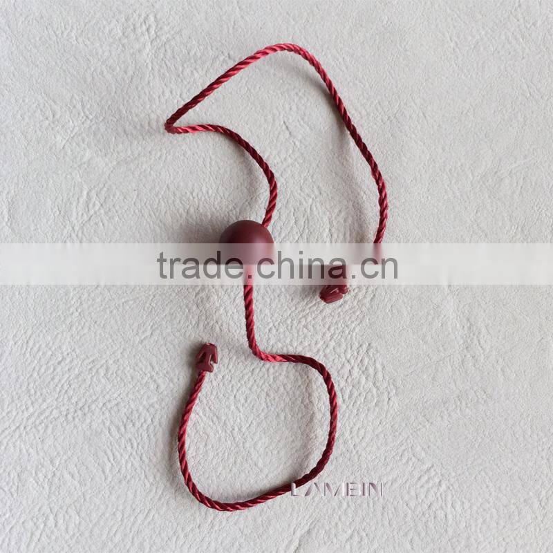Double insertion crystal string seal tag for high end garments