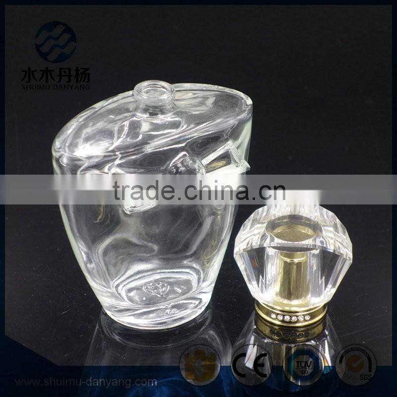 Hot sale 100ml clear glass perfume bottle with fancy cap