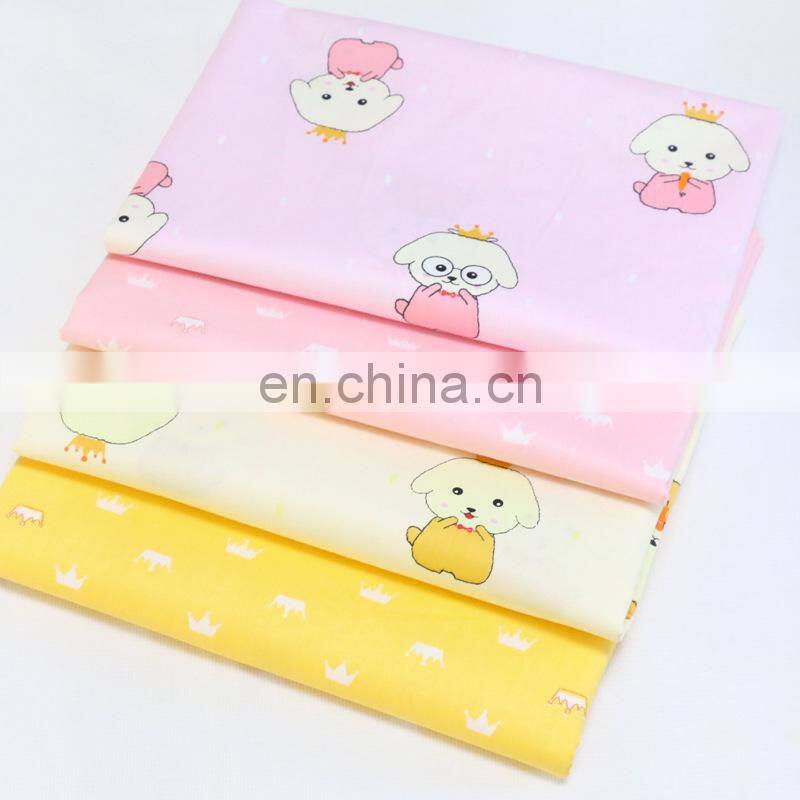 Kindergarten baby cloth cartoon dog crown printed cotton twill fabric environment-friendly printing and dyeing fabric