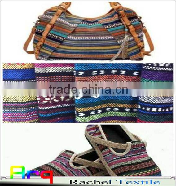 Multi colored fabric with many bright color, stripe design using for home textile or garments