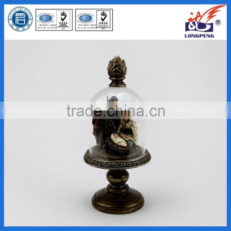 Stylized Holy Family Christmas Nativity Figurine with Decorative Glass Hurricane and Bronze-Look Finial and Pedestal Base