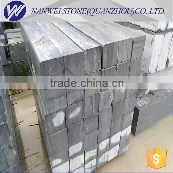 black and grey granite kerbstone and paving stone in city construction project stone material