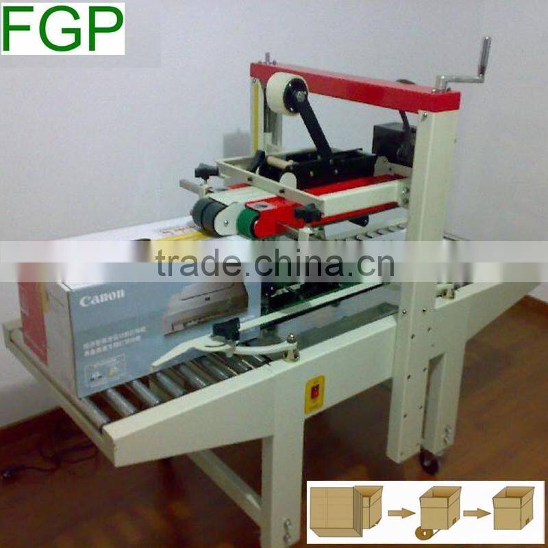 FXJ-5050 top & bottom drive paper carton automatic adhesive tape sealing machine
