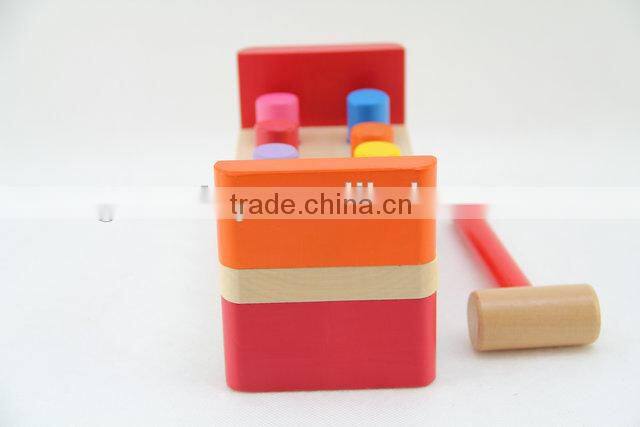 Wooden workbench toy with wooden hammer