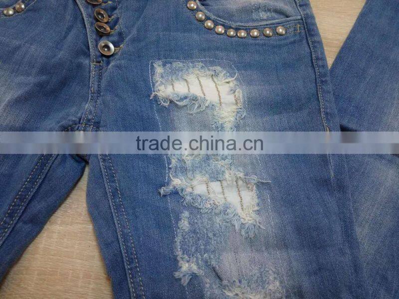 GZY cheap woman fashion Stocklots Women scratch jeans factory