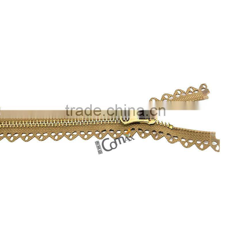 One close Euro style shiny gold metal zip for bag