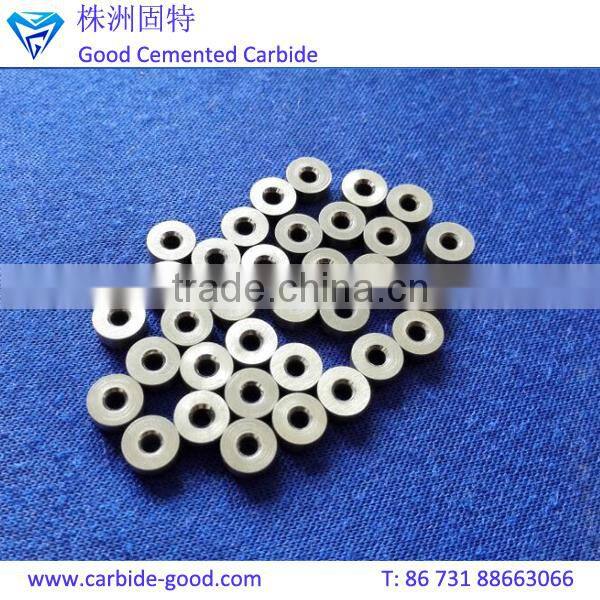 Discharge valve seat made from tungsten carbide