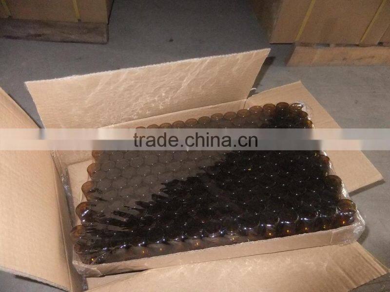 beautiful colored essential oil glass bottle