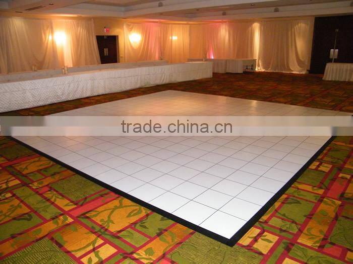 Natural teak wooden dance floor with gold anodized aluminum trim