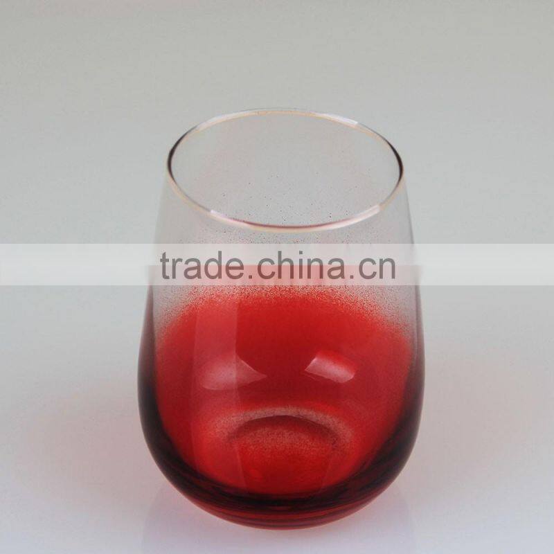 Red bottom stemless wine glass