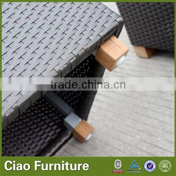 Outdoor Rattan Bench With Colorful Cushion Sitting