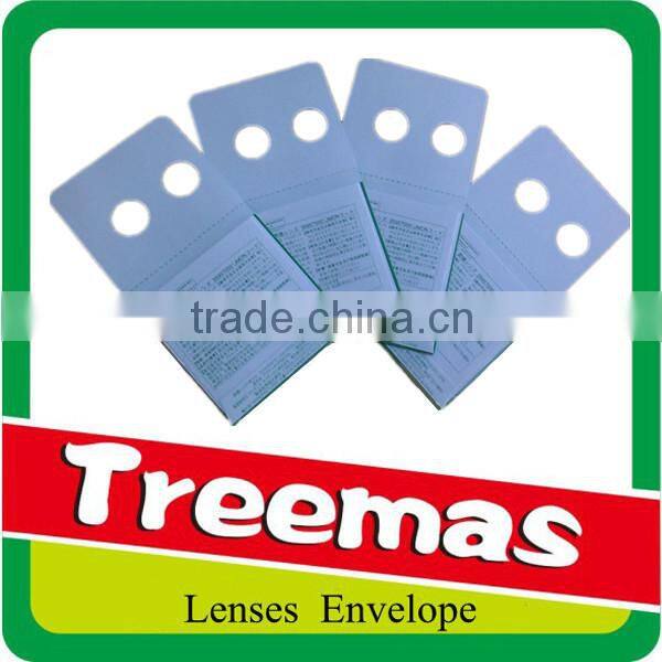 Lenticular aspherical padded envelope optical lens package with holes