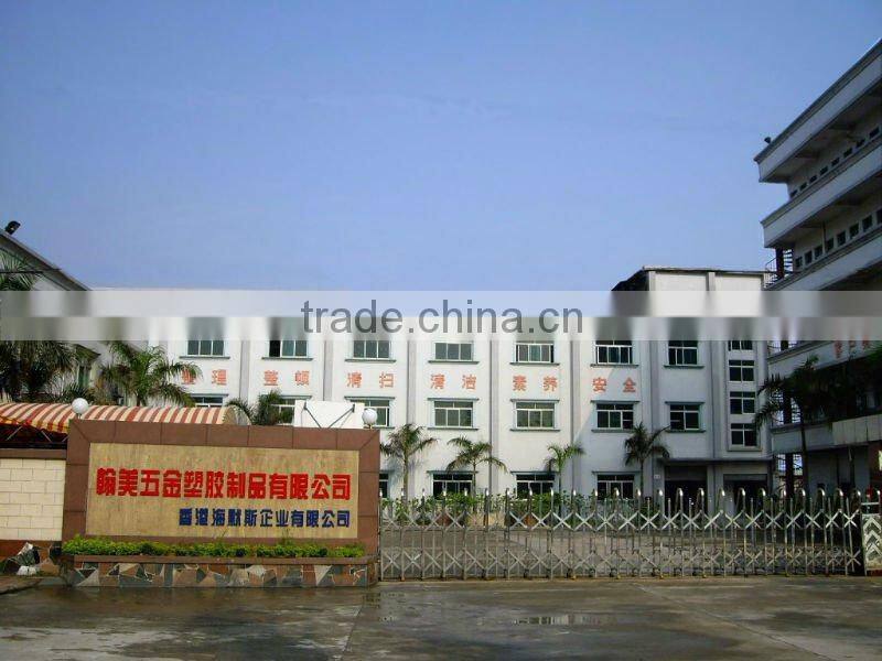 Golden badge/lapel pin/medal with green ribbon