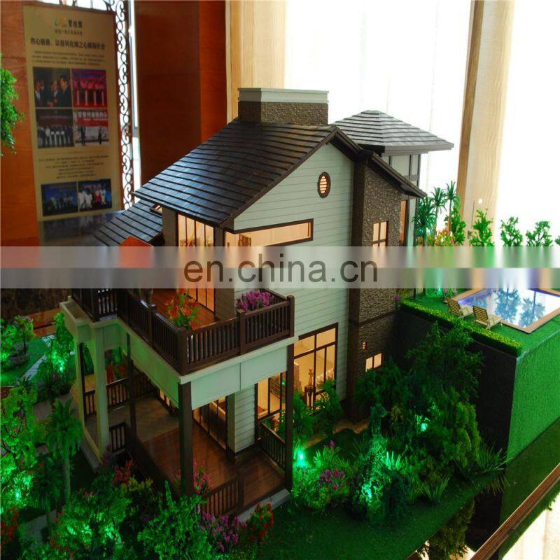 Small house model with warm light effect, architectural maquette