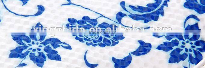 Blue and white diamond pattern cosmetic bag in hand