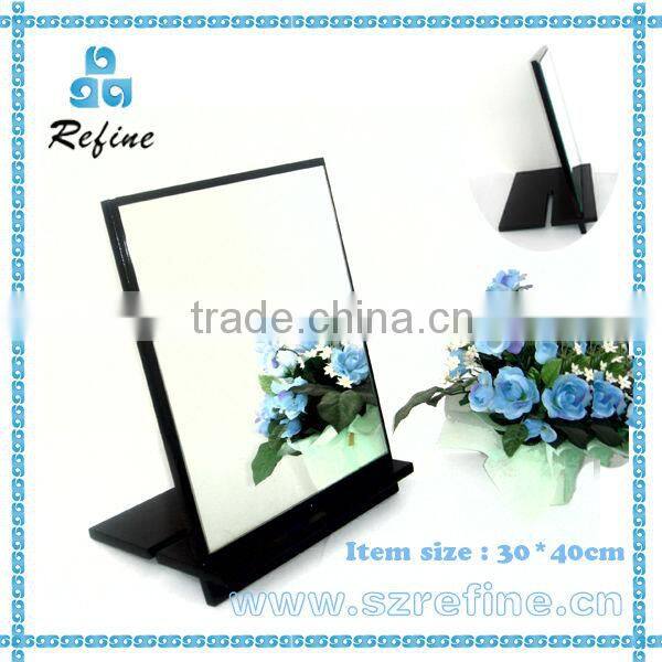 unframed small standing table mirror