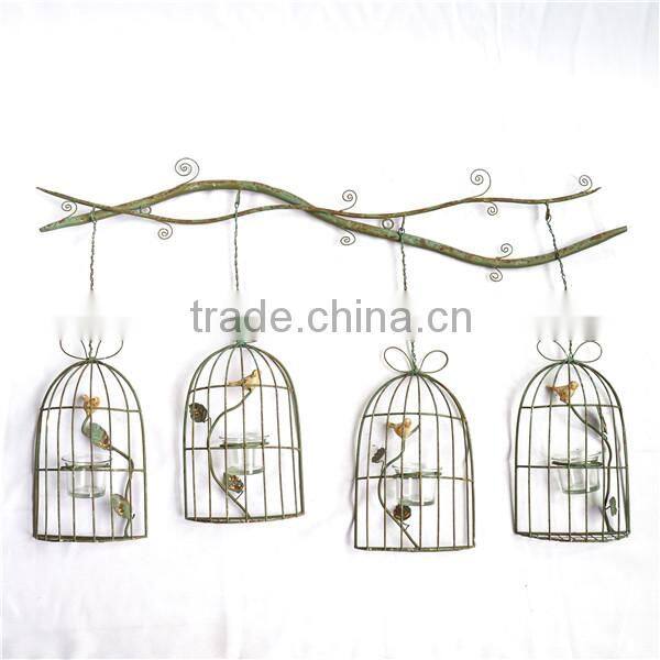 Metal tree branch with birdcage style wall plaque