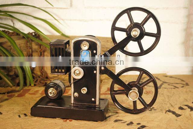 Antique metal movie camera model with paint