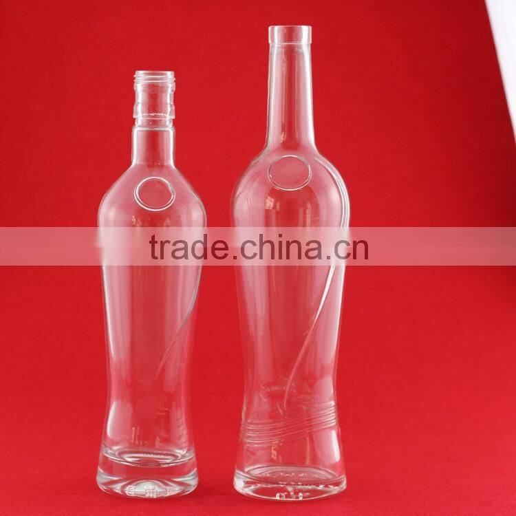 Hot selling cheap embossed spirit bottles glass vodka bottles 700ml french brandy bottle with cork