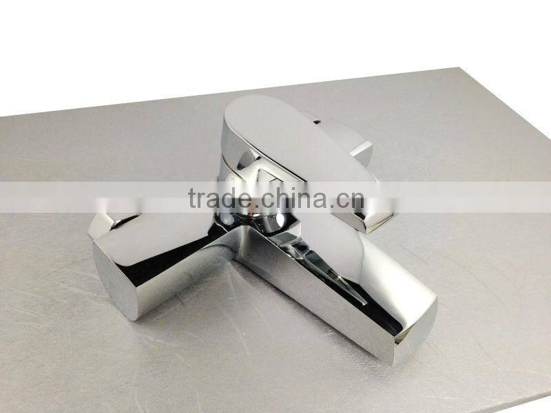 Exposed wall mounted bath and shower mixer tap with divertor