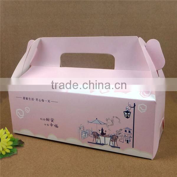 white or brown cakebox with handle
